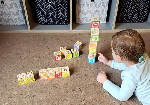 About WECORK - Child Playing on Floor